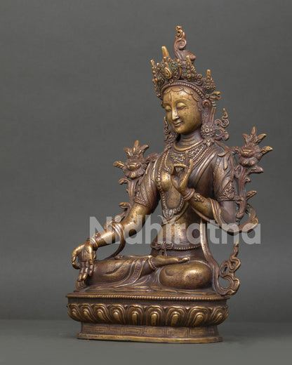 Left side view of handcrafted White Tara copper statue with detailed Buddhist artwork
