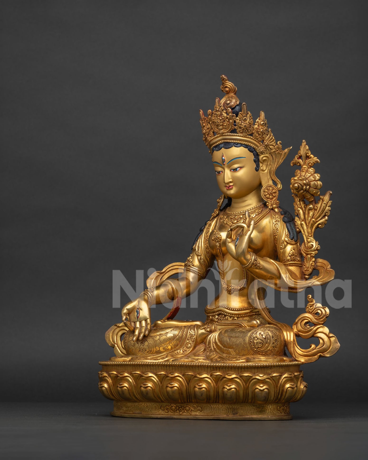 Left side view of handcrafted White Tara statue with semi-precious stones