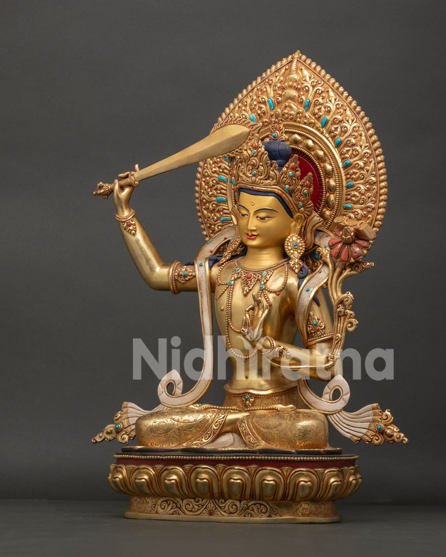 Left side view of Himalayan Manjushri Statue holding Prajnaparamita scripture