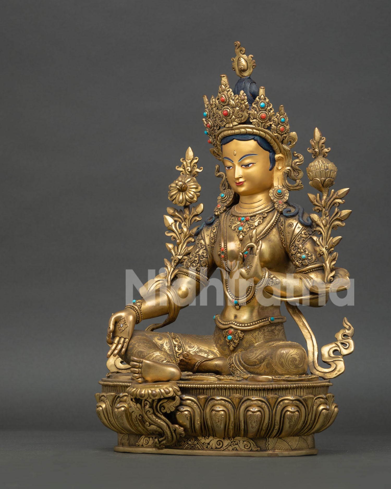 left side view of jetsun dolma statue showcasing copper craftsmanship and sacred details