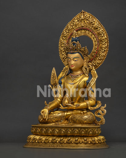 Left side view of Ksitigarbha Bodhisattva statue showing robes and gold gilding