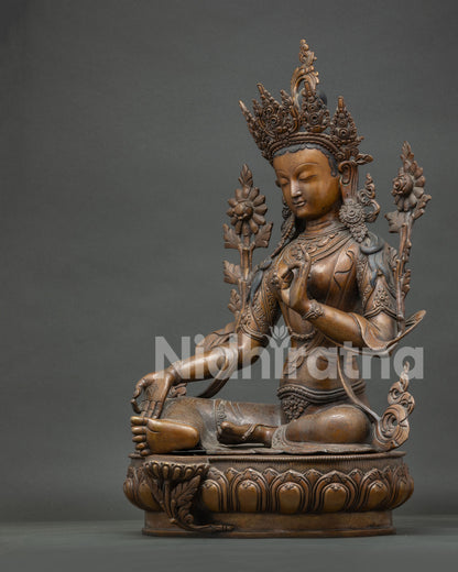 Left side view of large Green Tara copper Buddhist statue