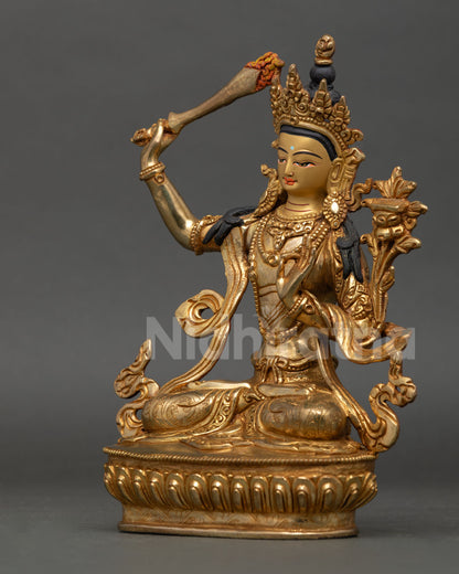 Left side view of Manjushri statue, Himalayan Buddhist altar art with fine gold gilded finish