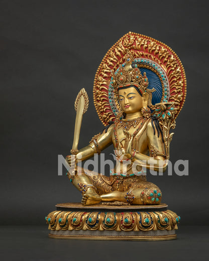 Left side view of Manjushri statue — utpala lotus stem and Prajnaparamita scripture detail