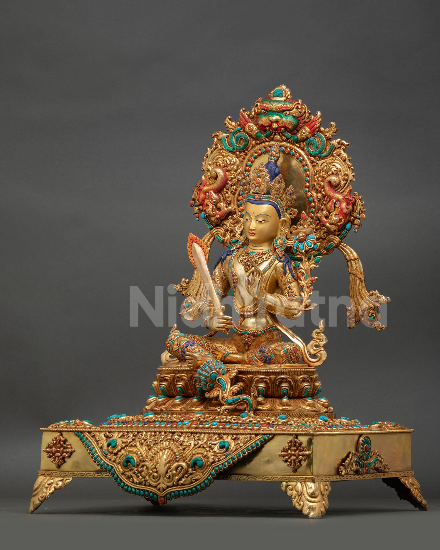 Left Side View Of Manjushri Statue With Lotus Seat And Ornate Halo Design