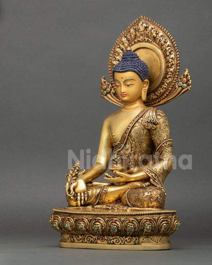 left side view of medicine buddha sculpture with fire gilded nepalese craftsmanship