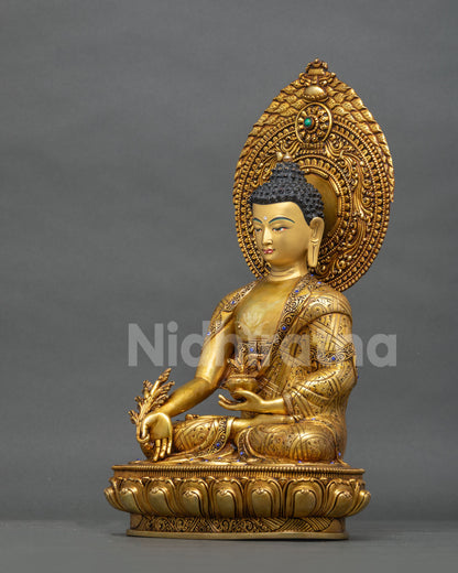 Left side view of Medicine Buddha statue, handcrafted gold fire-gilded Bhaishajyaguru sculpture