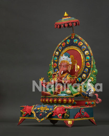 Left side view of Nepal Ganesh idol featuring traditional artwork and gemstone accents