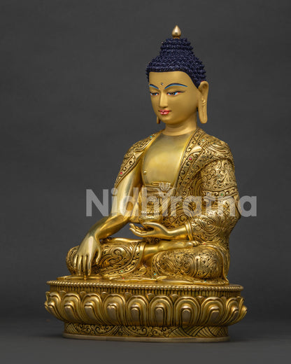 Left side view of Nepalese Shakyamuni Buddha statue holding sacred patra bowl