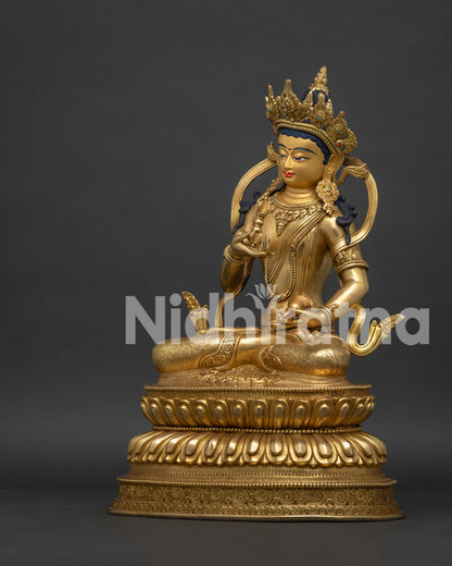 Left side view of Nepalese Vajrasattva Statue with ornate jewelry and lotus throne