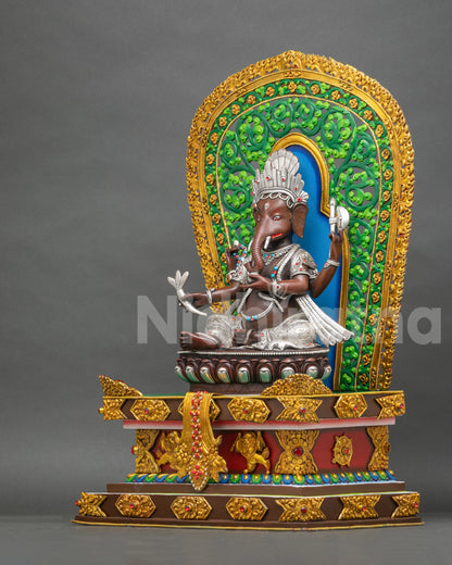 Left side view of Newari Ganesh idol on vibrant lion throne, oxidized copper and gold gilded art