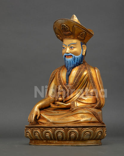 Left profile of Zhabdrung Ngawang Namgyal statue with gold fire-gilded finish and lotus pedestal