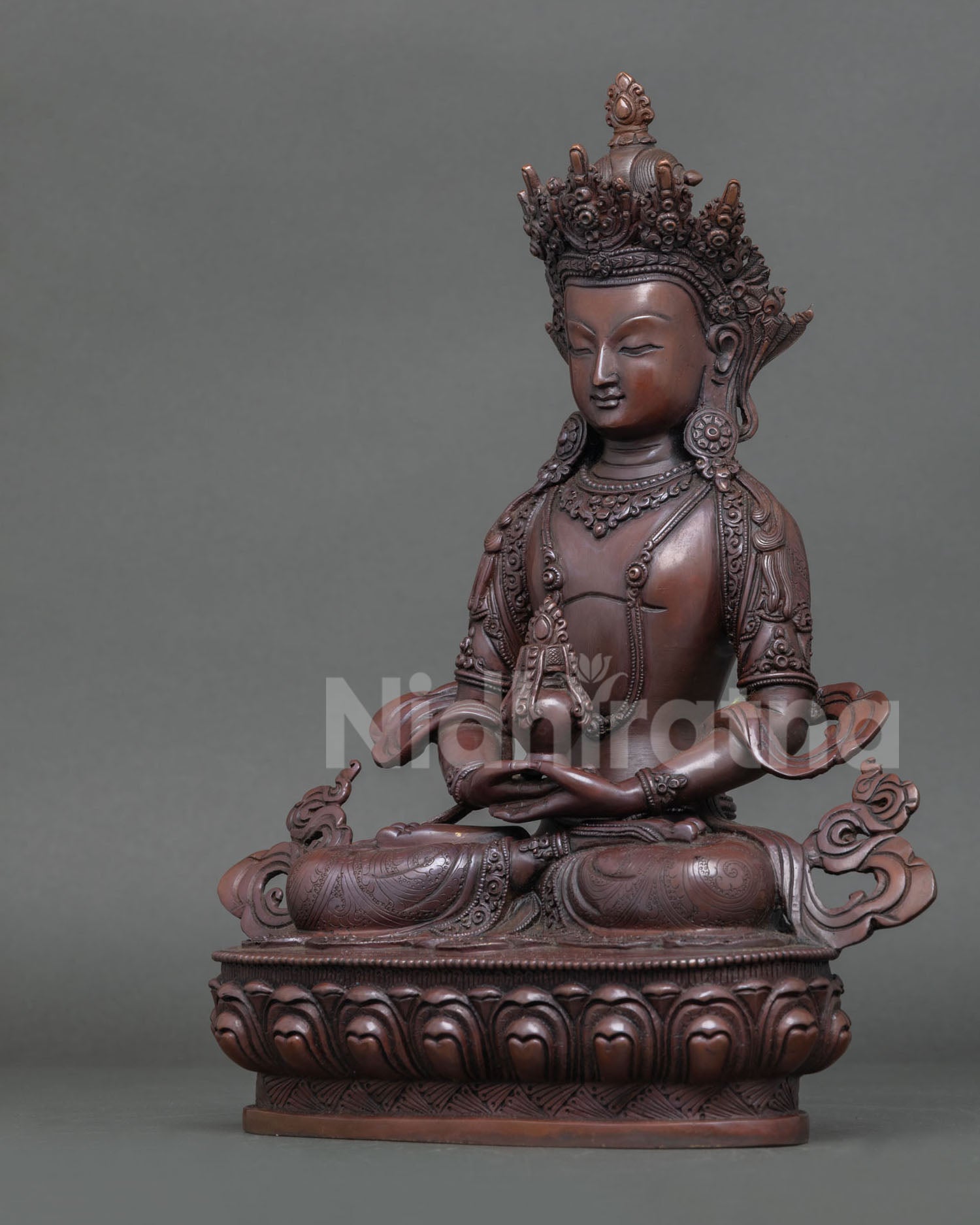 Left side view of oxidized copper Amitayus Buddha statue with traditional Himalayan craftsmanship