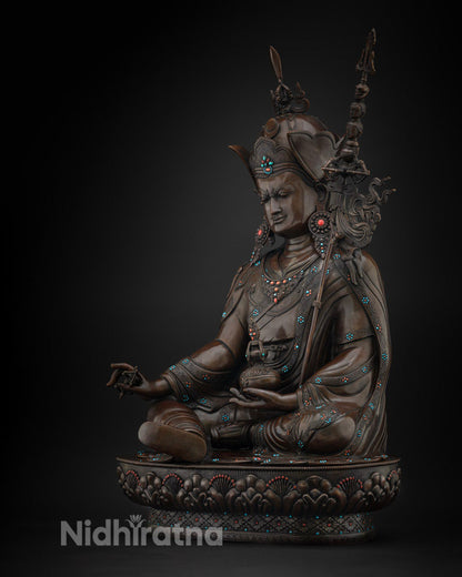 Left side view of oxidized copper Guru Rinpoche statue