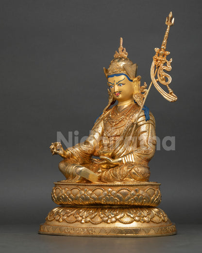 Left-side view of Padmasambhava statue displaying sacred ornaments and lotus throne details