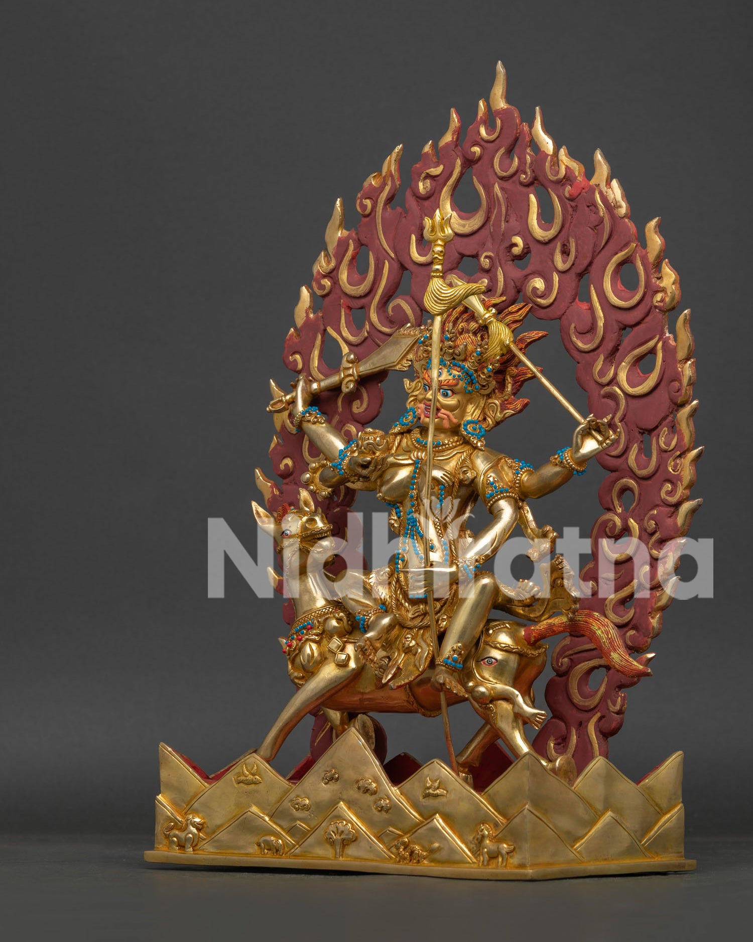 Left side view of Palden Lhamo Statue with embossed mountain base and sacred ornaments