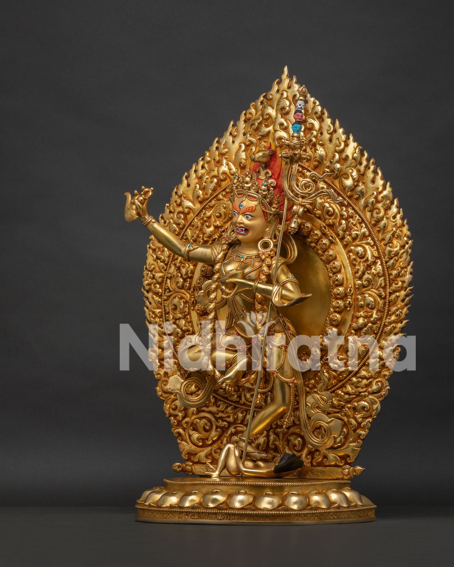 Left side view of Rare Dorje Phagmo Vajravarahi Statue with trident and gold-gilded copper body
