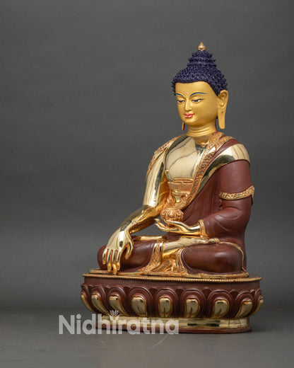 left side view of Shakyamuni Buddha statue, fire gilded gold Buddhist art Nepal