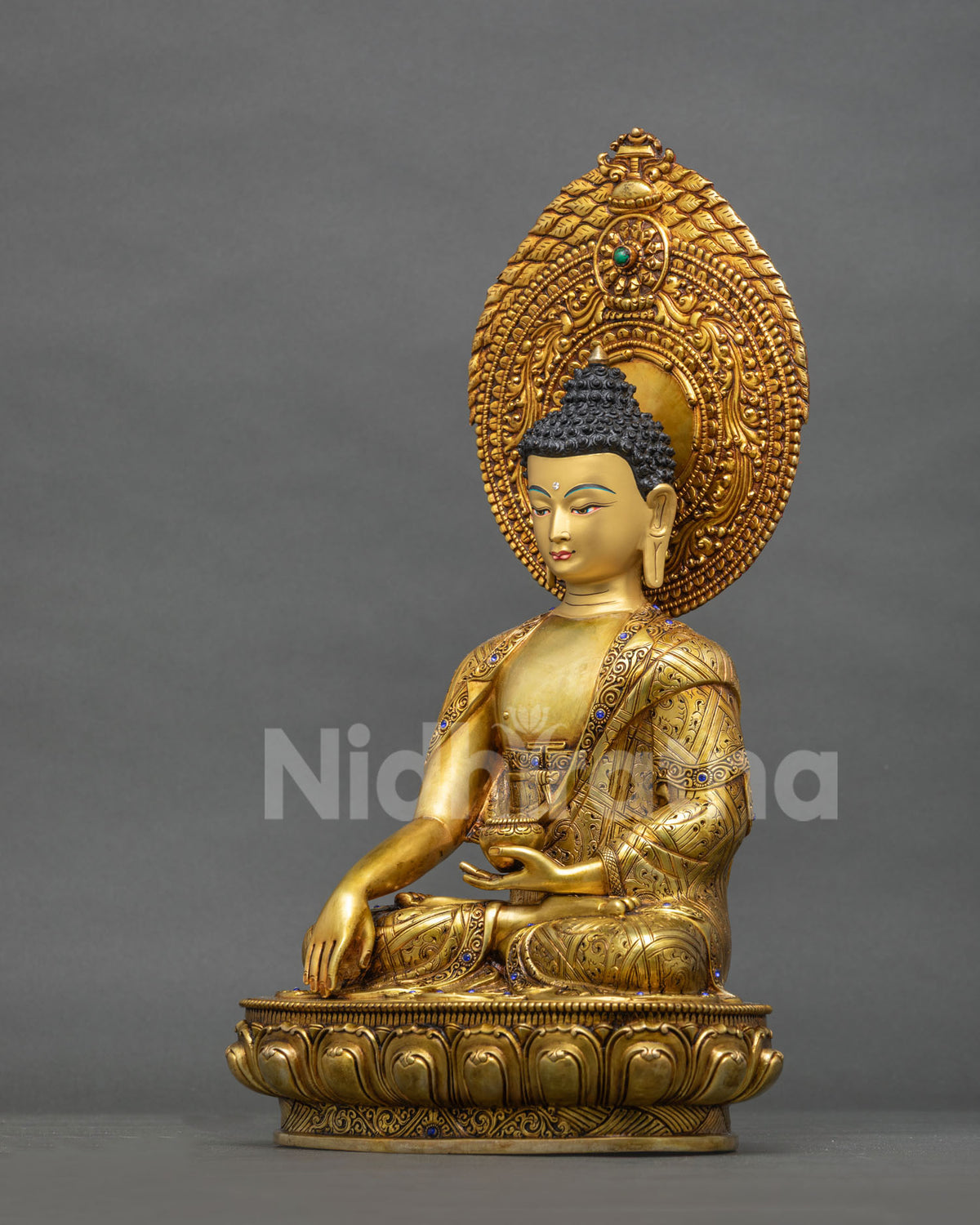 Left side view of Shakyamuni Buddha statue, handcrafted gold fire-gilded Buddhist sculpture with halo