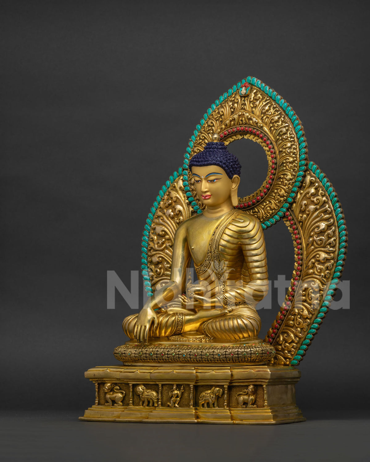 Left side view of Shakyamuni Buddha statue holding begging bowl in Kasaya robe