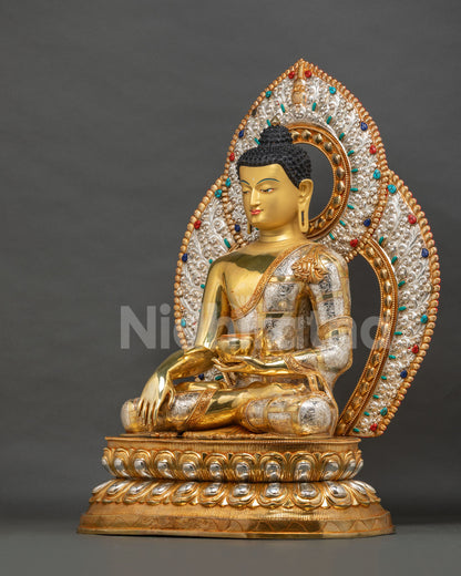 Left side view of Shakyamuni Buddha statue in earth-touching gesture with gilded silver halo