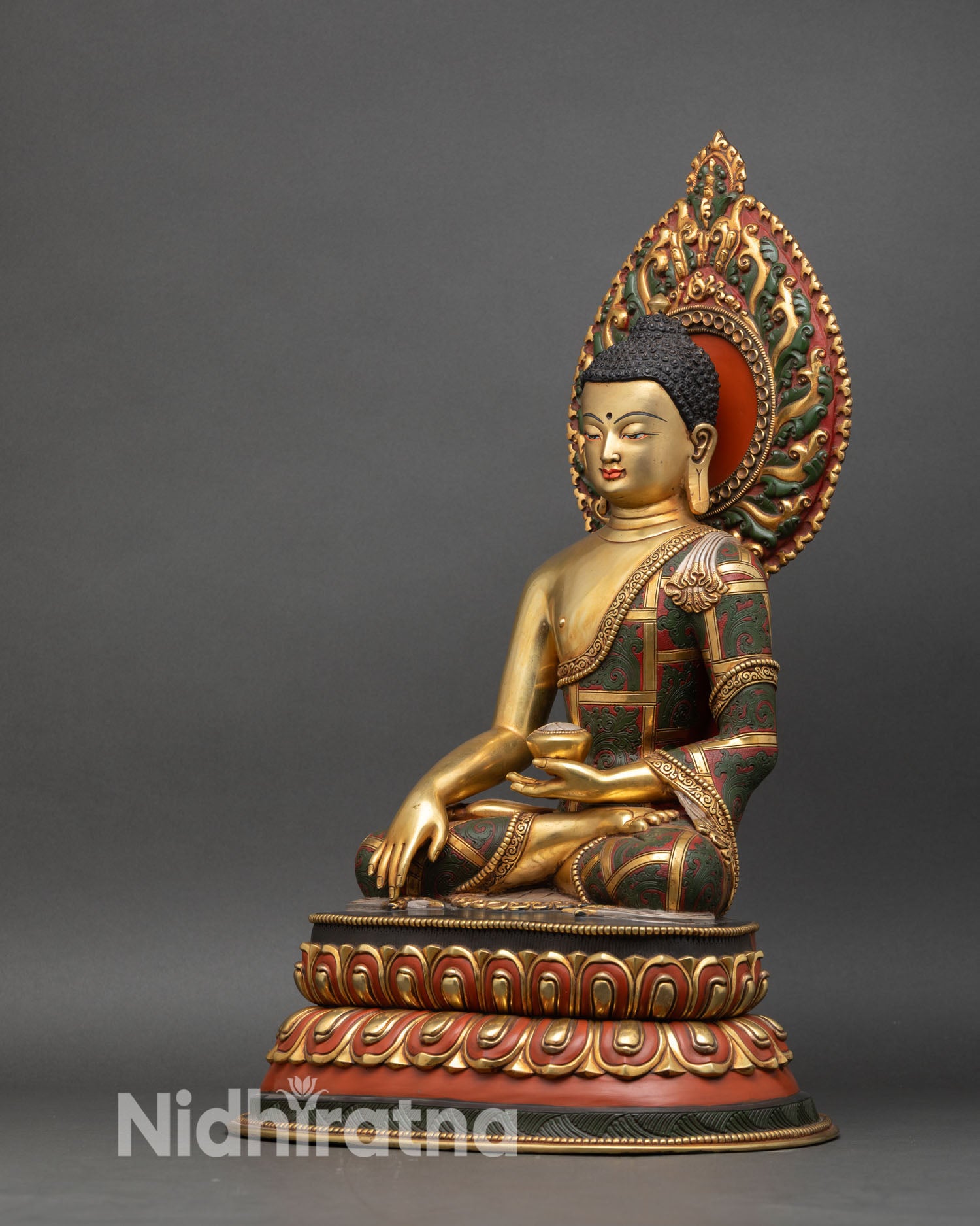 left side view of shakyamuni buddha statue in gold gilded copper nepalese art