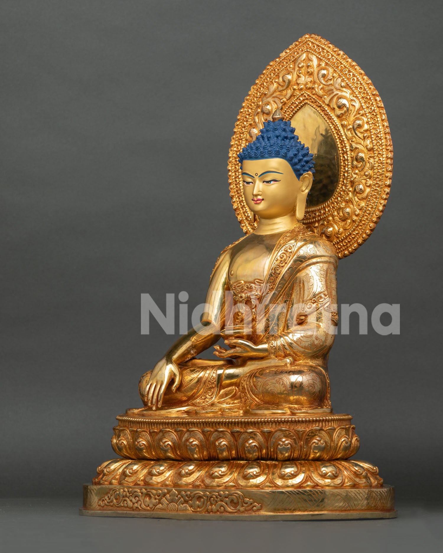 Left side view of Shakyamuni Buddha Statue on double-lotus seat, gold fire-gilded copper