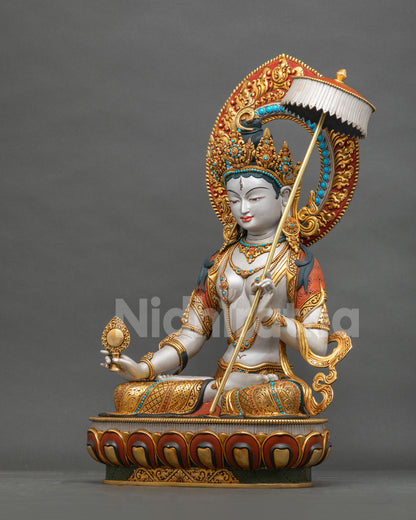 Left side view of Sitatapatra Dukkar statue showing flowing robe and halo, gold-gilded copper from Nepal