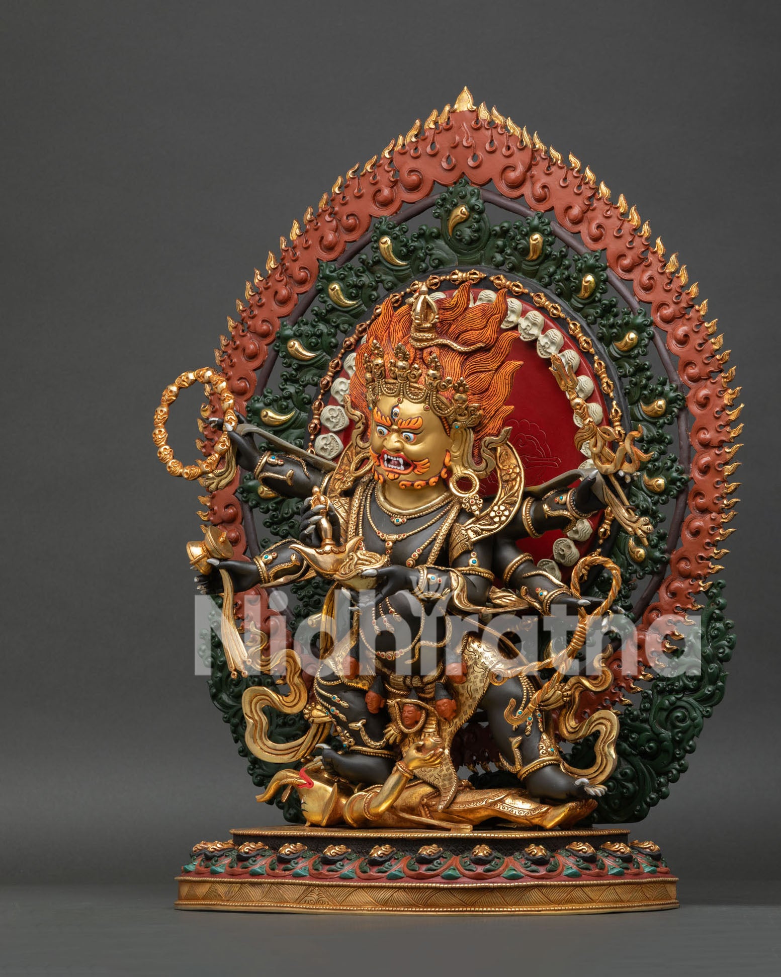 Left Side View of Six Armed Mahakala Statue with Tiger Skin and Gold Gilded Details