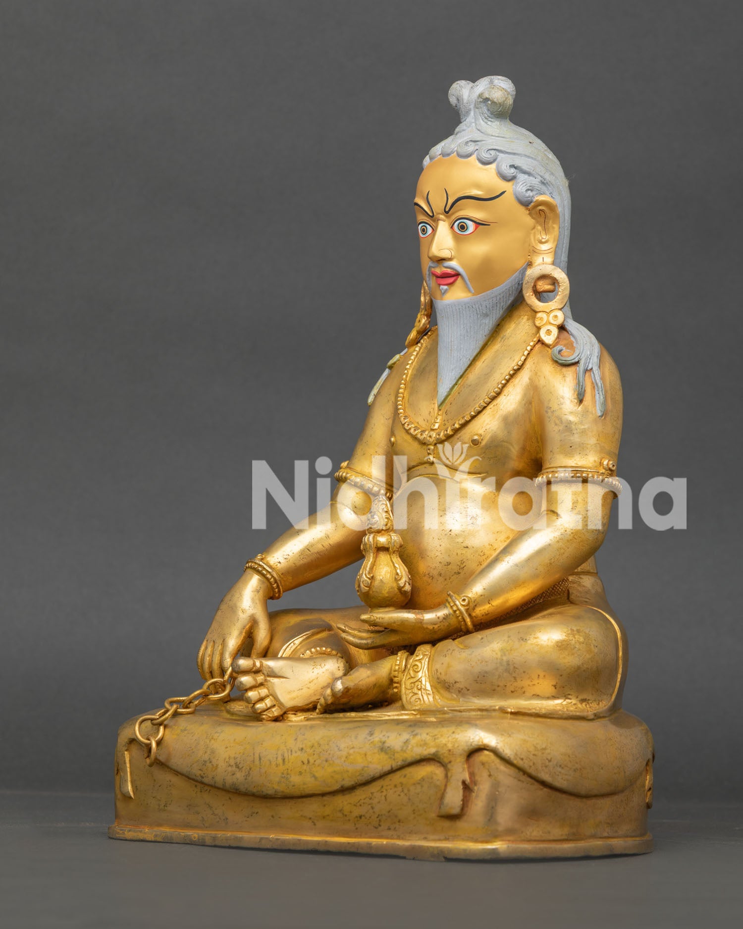 Left side view of Thang Thong Gyalpo Statue handcrafted in copper with ornate details