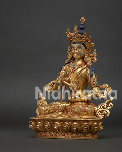 Left side view of the gold gilded Vajrasattva Buddhist statue crafted using the ancient lost wax method.