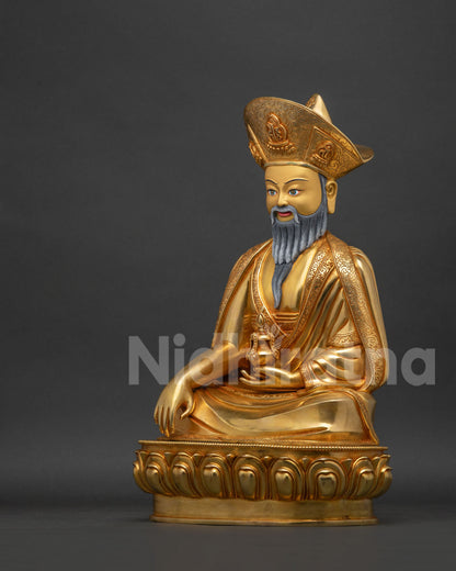 Left side view of the Zhabdrung Rinpoche statue's graceful seated posture