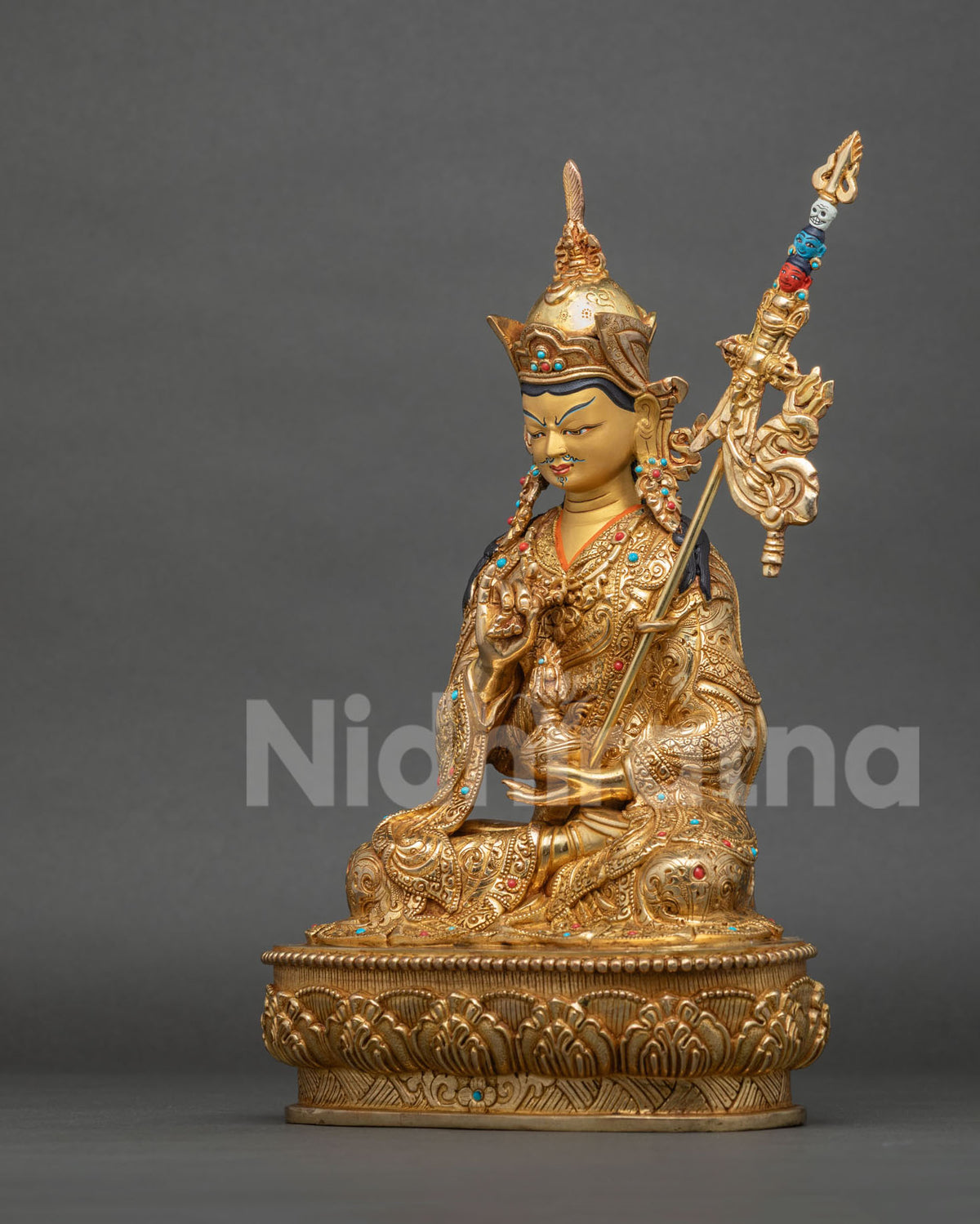 Left side view of Tsokye Dorje statue, Lake-Born Vajra on lotus pedestal with turquoise and coral inlay