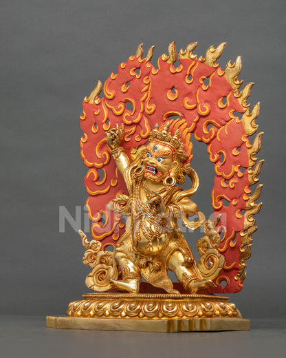Left side view of Vajrapani statue in wrathful stance with flaming halo, gold-gilded copper