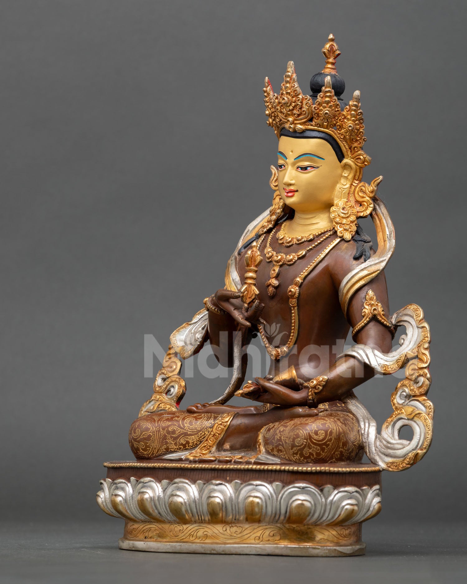 left side view of vajrasattva purification deity statue in oxidized copper finish