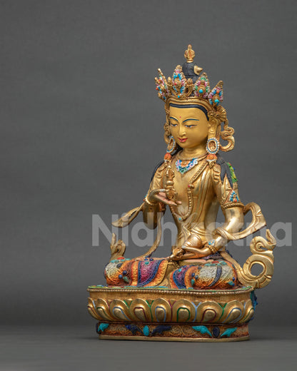 Left side view of Vajrasattva statue in meditation posture, silver filigree with turquoise and lapis