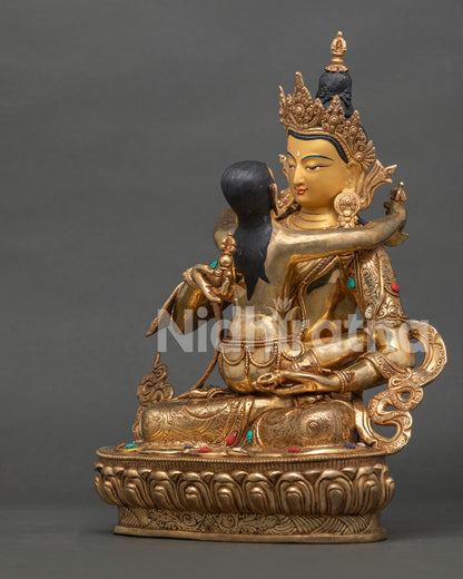 left side view of vajrasattva yab-yum statue showing handcrafted copper details from nepal