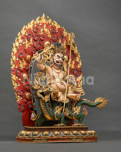 Left side view of White Dzambhala statue on a dragon, hand-painted copper with gold gilding from Nepal