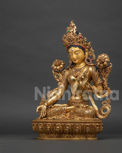 Left side view of White Tara Statue showing lotus throne and flowing robe details