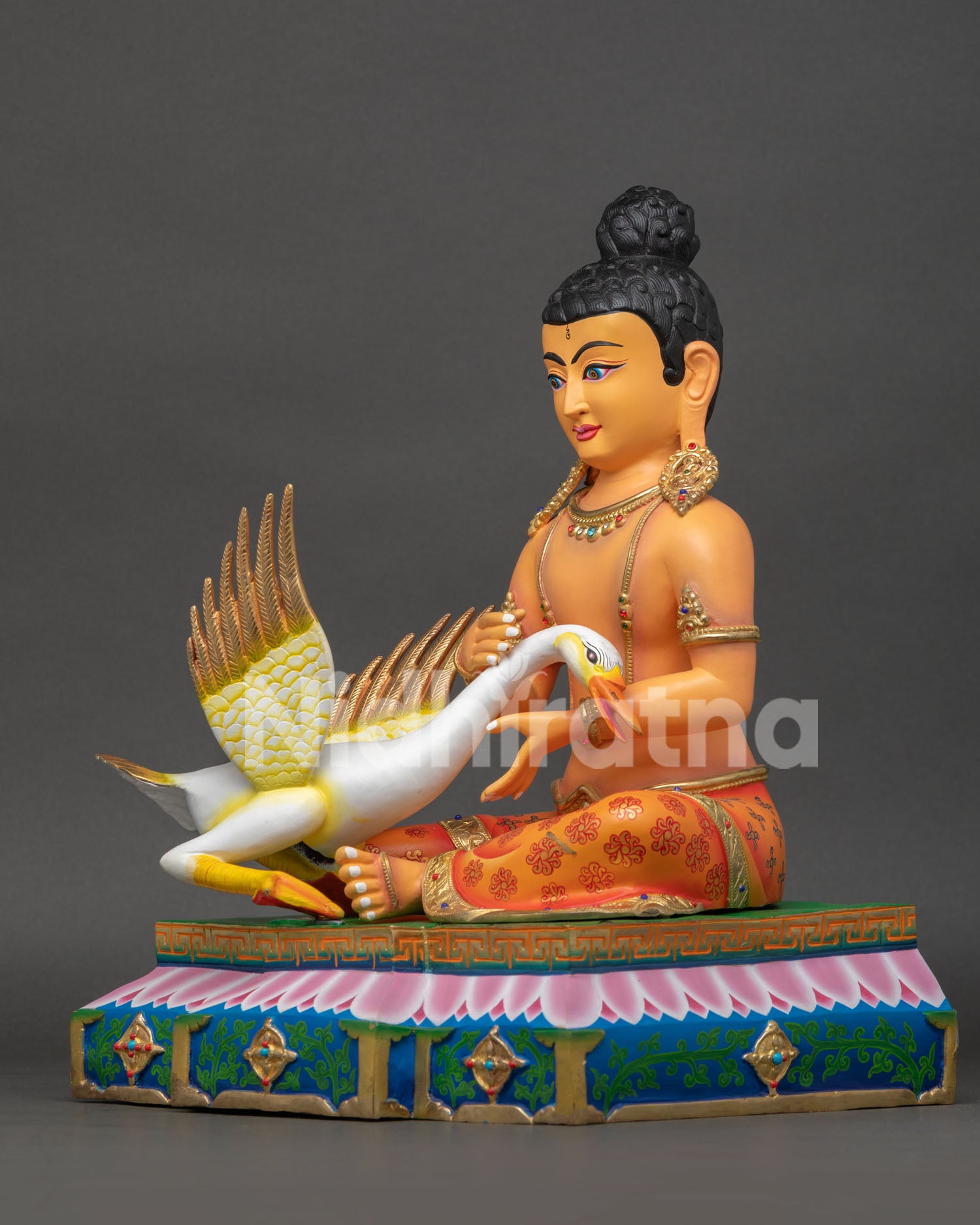 Left side view of Young Buddha Saving the Swan gold gilded Buddhist sculpture