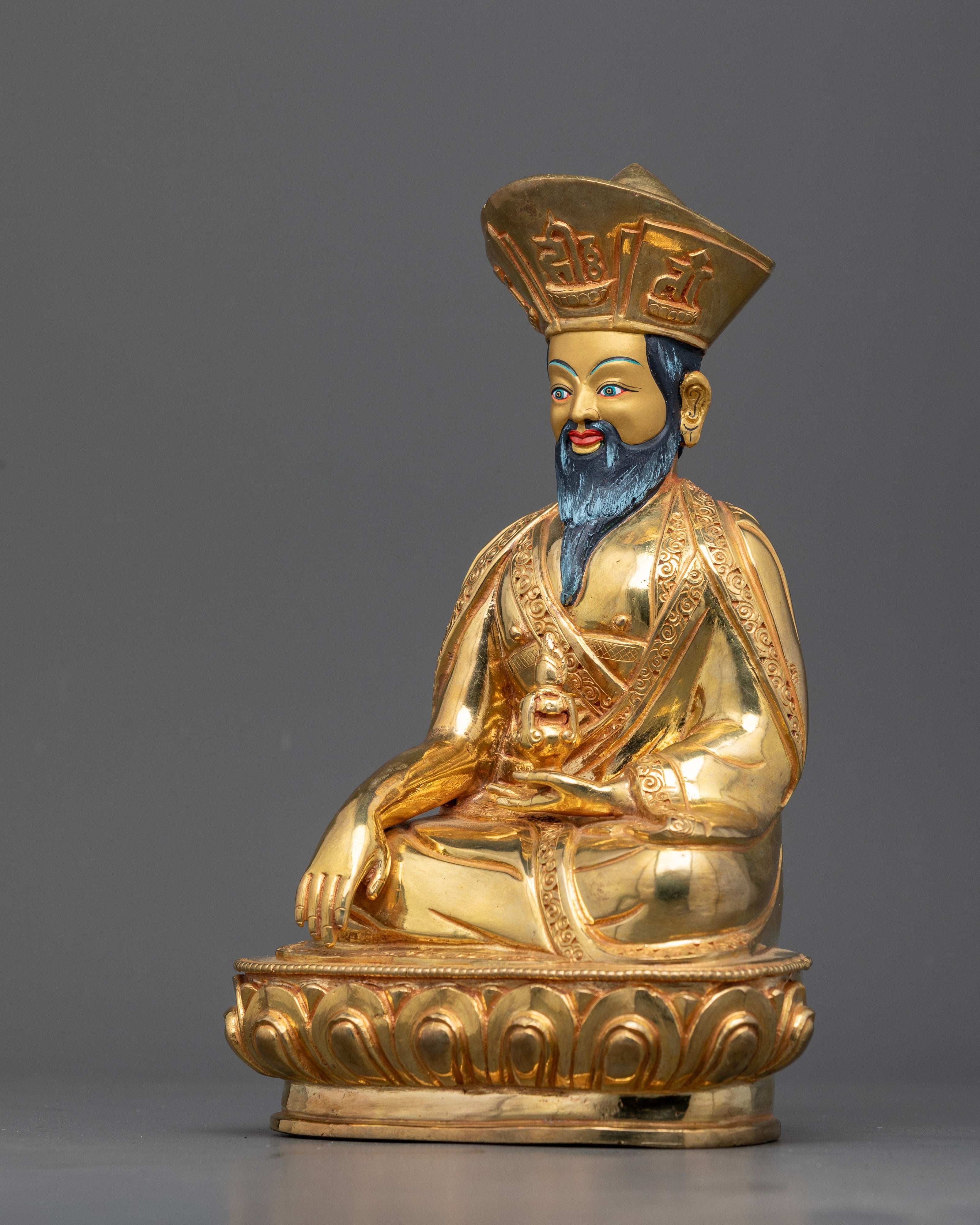 Left side view of zhabdrung ngawang namgyal statue highlighting seated posture and traditional iconography