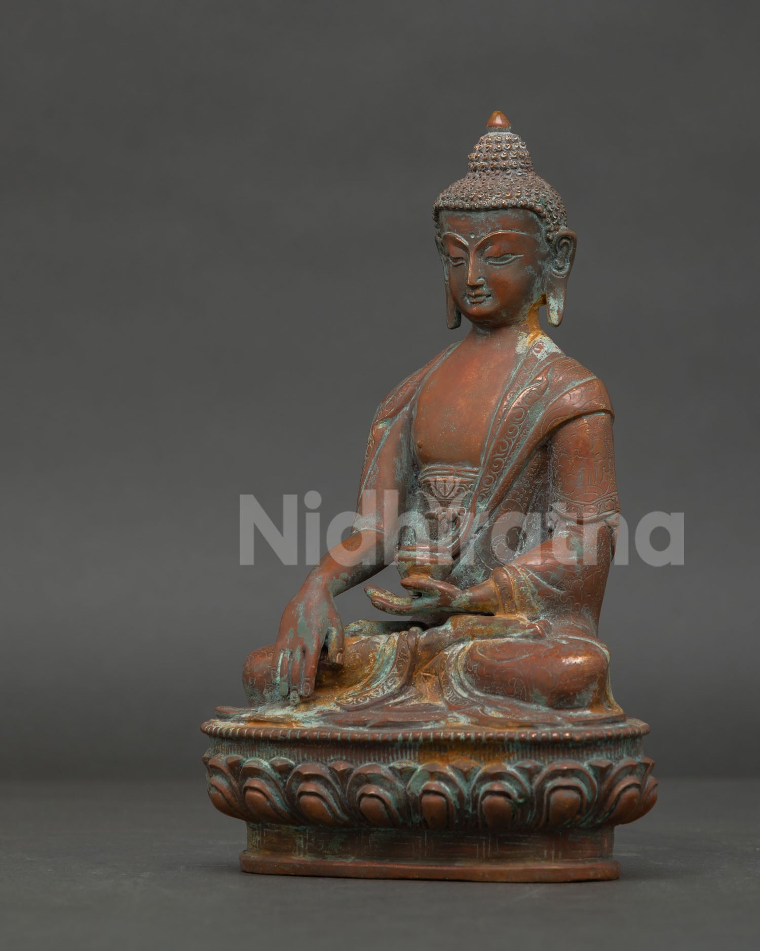 left side view oxidized shakyamuni buddha statue traditional nepalese buddhist sculpture
