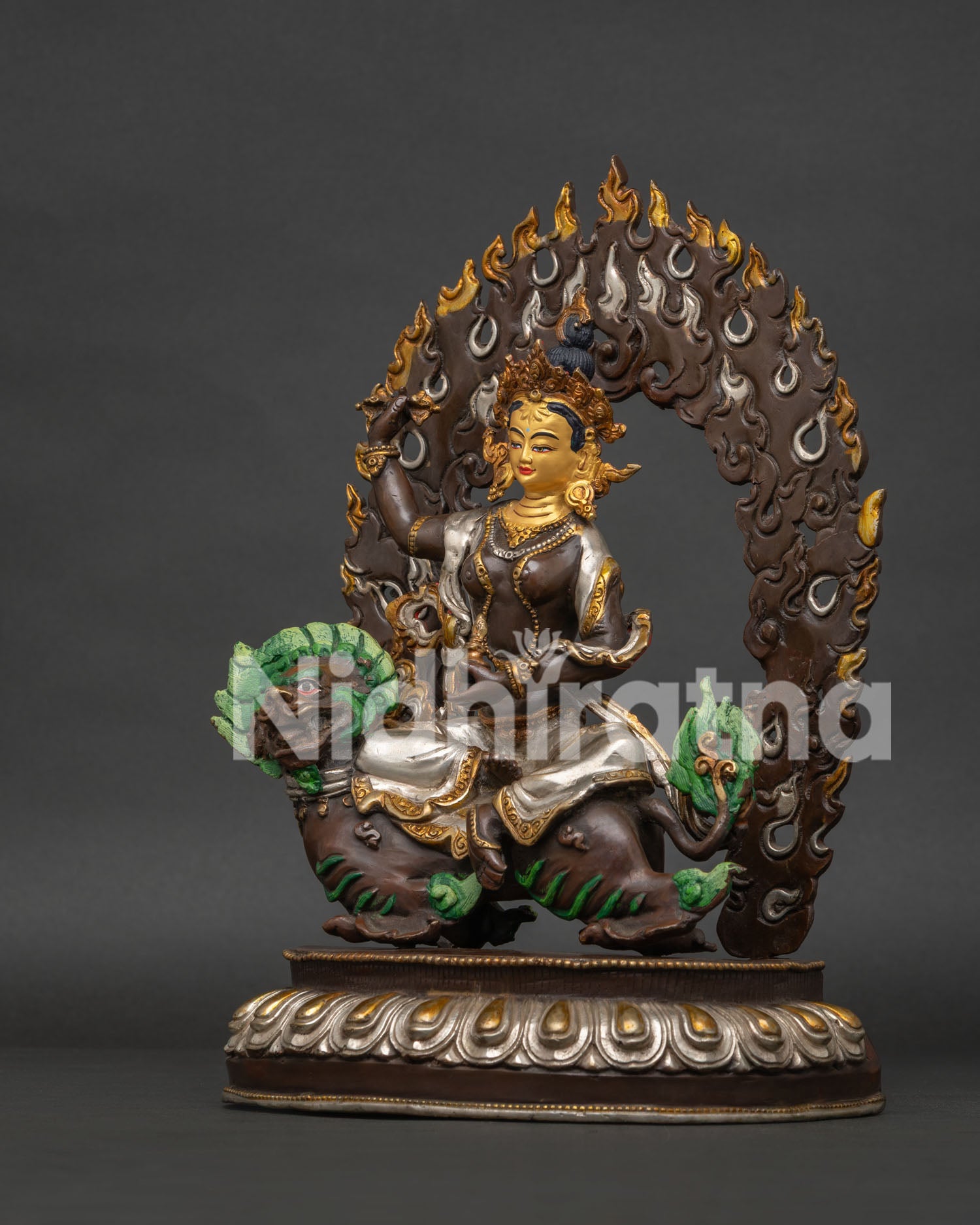 Left side view showing silver-plated detailing on Tsheringma statue