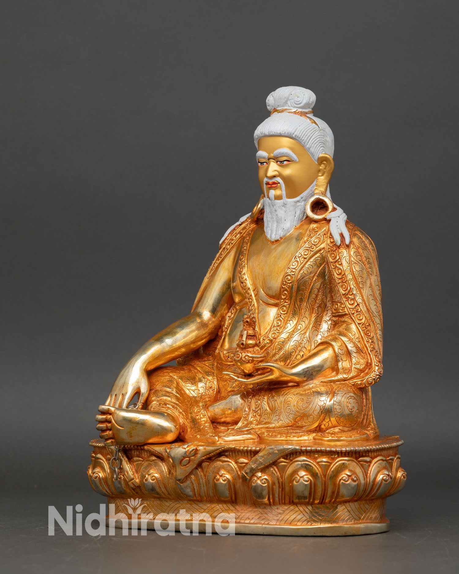 Left side view Thangtong Gyalpo statue, lotus pedestal Nepal art