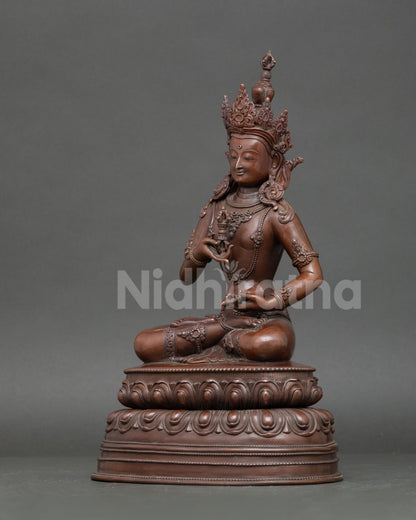 left side view Vajrasattva statue oxidized copper vajra bell iconography Nepal