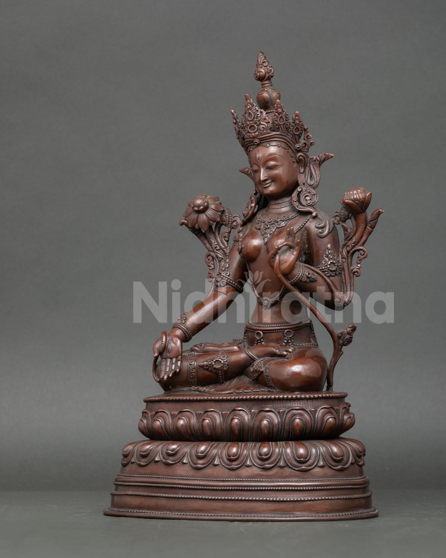 Left side view White Tara statue, graceful profile, oxidized copper finish, Himalayan sacred sculpture