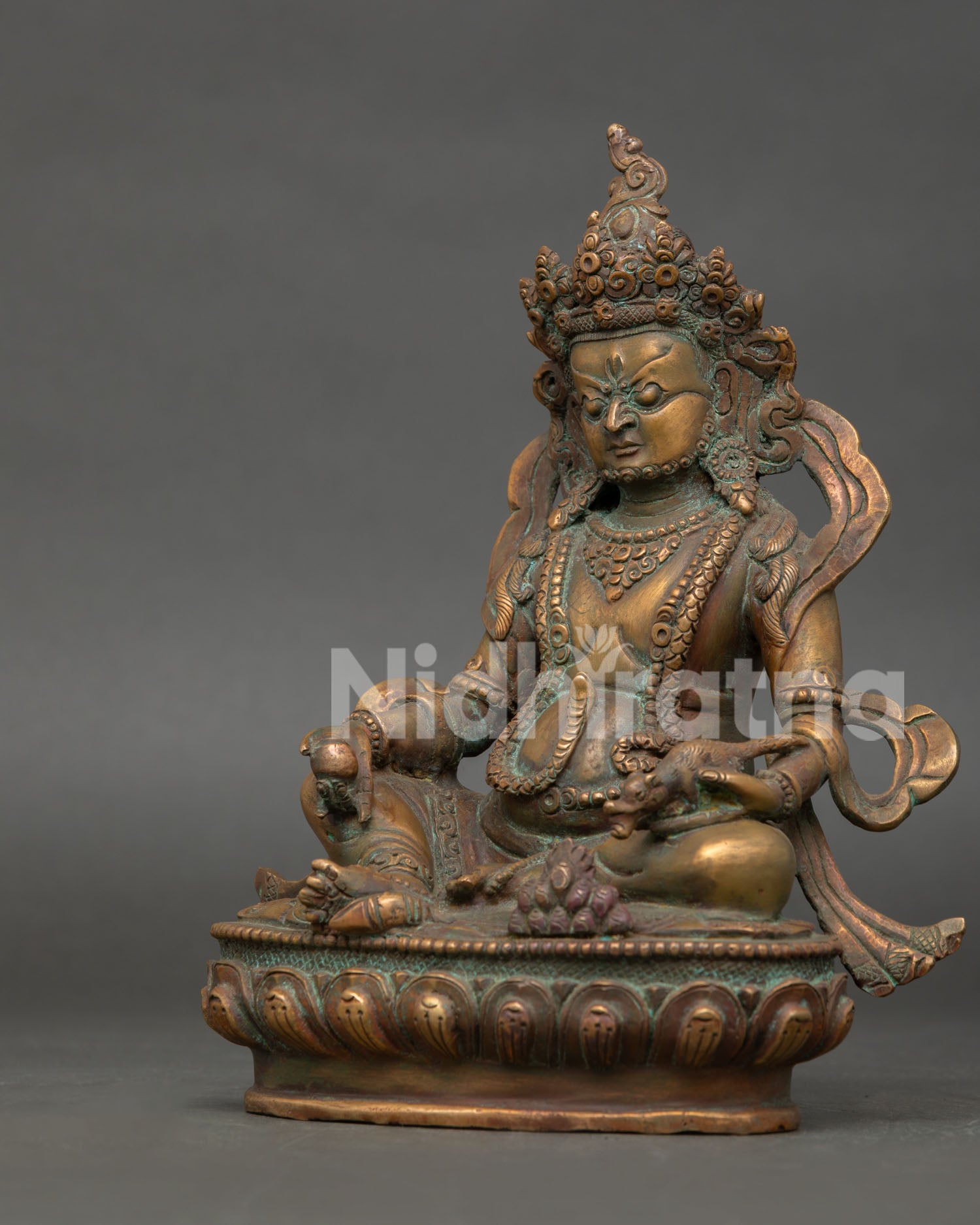 left view of authentic jambhala statue showcasing traditional newari metal artistry