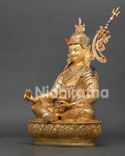 Left view of Guru Padmasambhava Statue with trident, flowing robes and sacred details