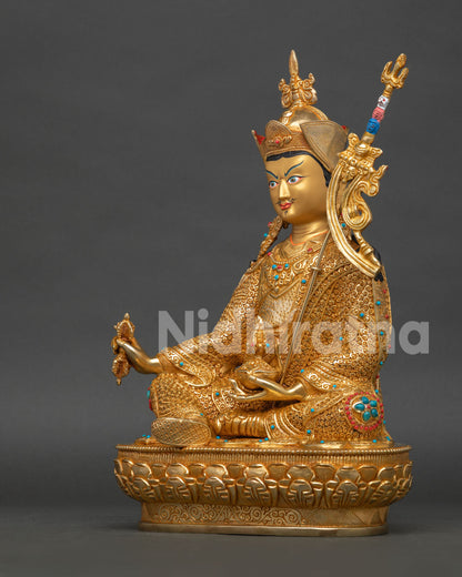 left view of guru rinpoche statue fire gilded copper sculpture