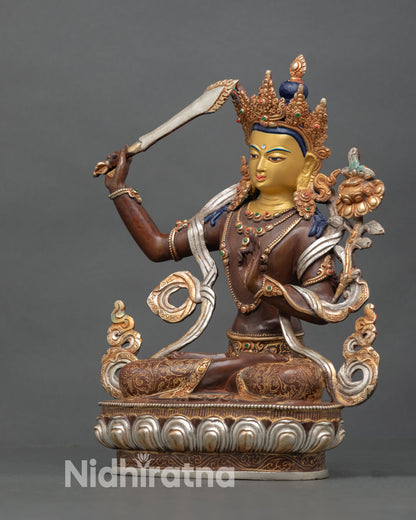 left view of handcrafted manjushri statue holding utpala flower stem